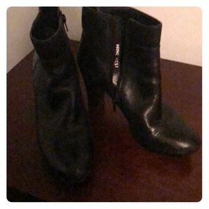 Black ankle booties leather heels.